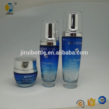 Customized blue coating cosmetic glass lotion bottle / cream jar