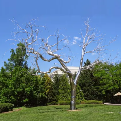 Abstract polished stainless steel pigeon sculpture