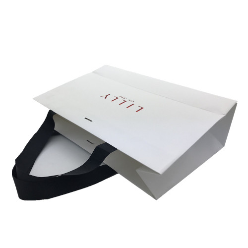 Corrugated paper gift containing shopping bag