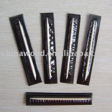 Cello wrapped wooden toothpick with black background