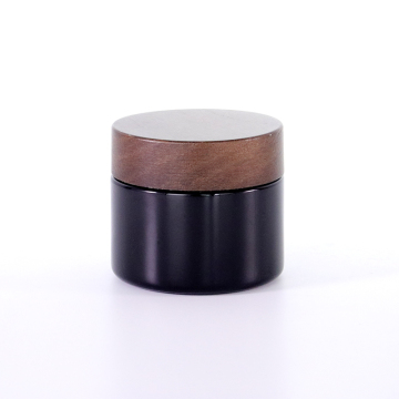 Black frosted glass cream jar with wooden cap