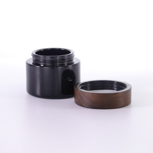 Black Cosmetic Jar for Skincare Eco-friendly Black frosted glass cream jar with wooden cap Factory