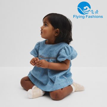 A children's top decorated with denim lace