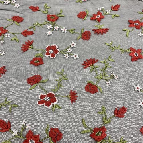 White Poly Yarn Embroidery On Black Mesh Fabric
