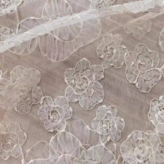 Irregular layered coiled embroidery fabric