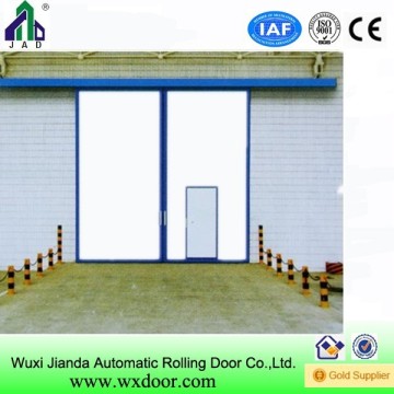 Sliding door used in the big warehouse POP in Qatar|with small door on it