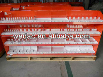 Retail cosmetic display rack with pushers