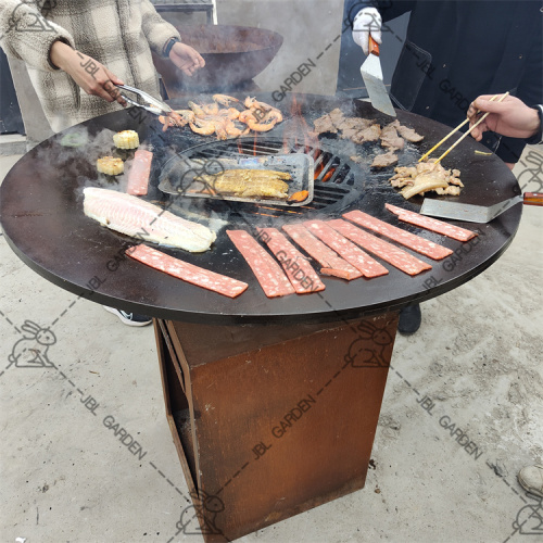 Corten steel fire pit with wooden grill bbq