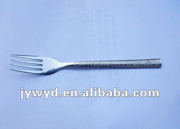 stainless steel dinner fork with nice patterns on handle