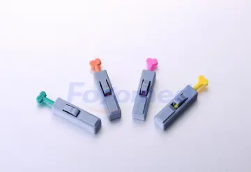 Button Activated Safety Lancets