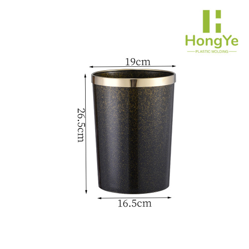 Papelera abierta decorativa con borde dorado y brillo negro redondo