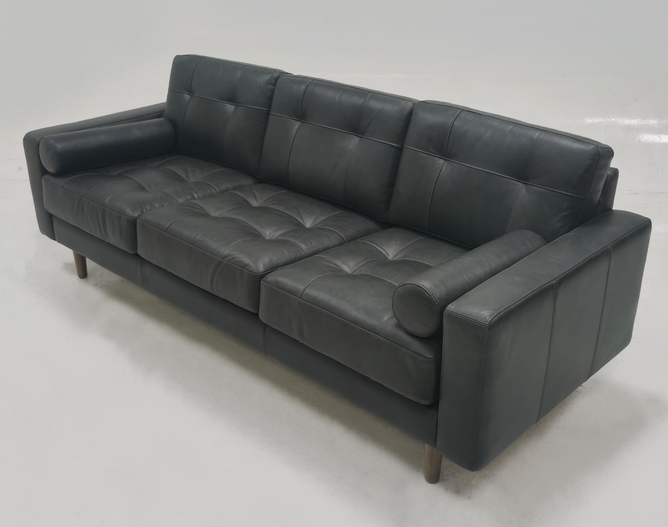 Light colored leather three person sofa