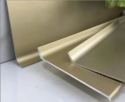 Aluminum transition profiles for wall-to-floor junctions