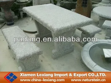 Grey stone bench with table