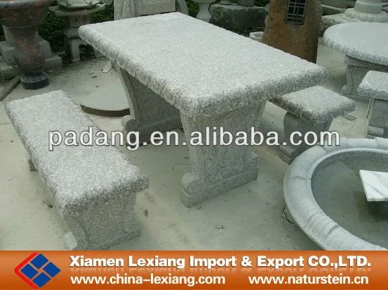 Grey stone bench with table