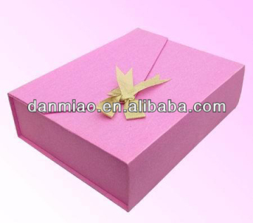 Pink collapsible paper cardboard gift box with bow