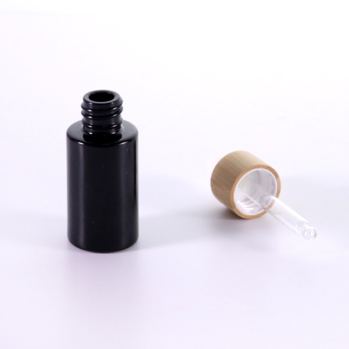 Black flat shoulder glass essential oil bottle