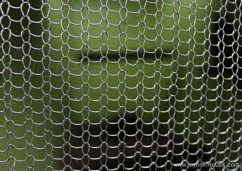Flattened knitted wire mesh