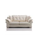 Elegant white tufted leather sofa with ruffled accents