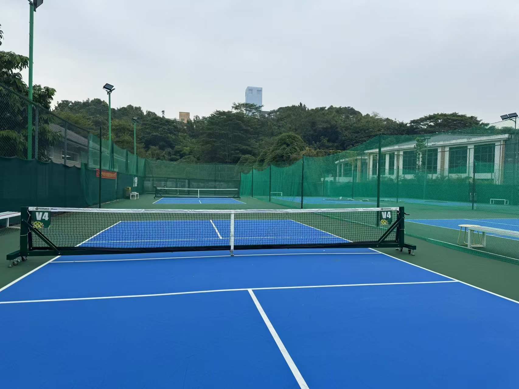 Movable pickle ball post
