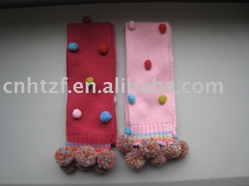 knitted children's scarf with colorful hand crochet flower and pompong