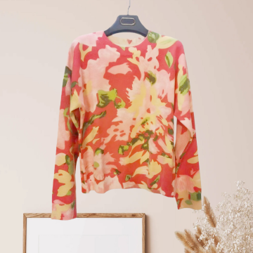 Suéter elegante con cuello redondo y punto floral