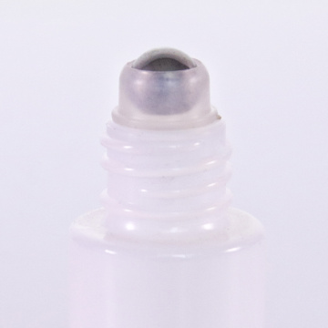 White glass roll on bottle with wooden lid