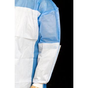 Disposable sugical gown material with reinforced piece