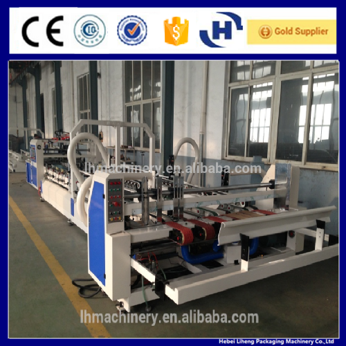 Automatic corrugated carton box folding gluing machine