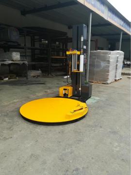 Automatic clamp and cut pallet wrapping machine