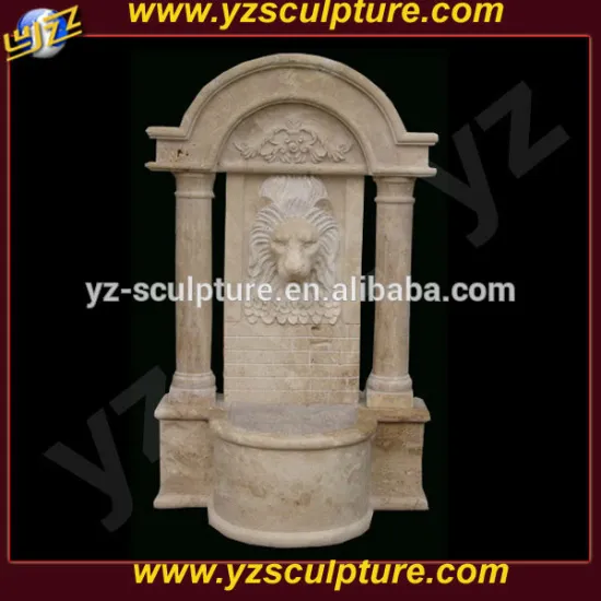 antique wall water fountain with lion head carving