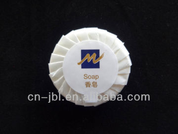 small white round disposable hotel soap
