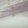Tulle trasparente in nylon con luna e stelle dorate glitterate