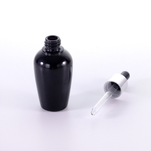 Black glass bottle with silver dropper cap