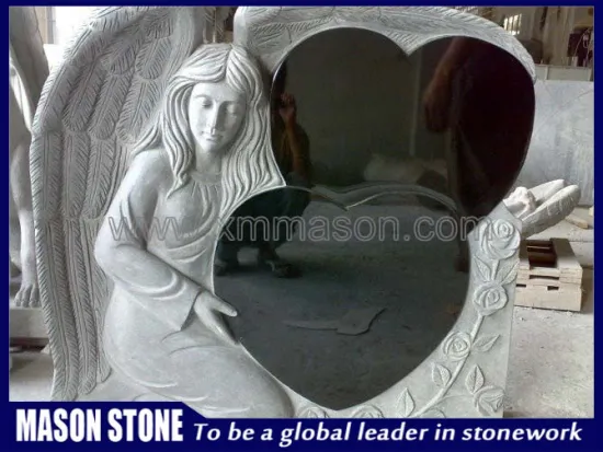 Stone angel sculpture with double heart
