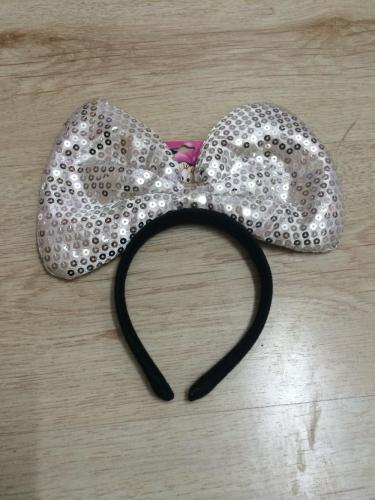 A headband with a big bow