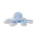 A blue octopus sleeps with a stuffed animal