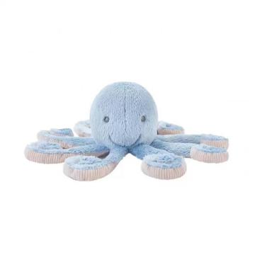 A blue octopus sleeps with a stuffed animal