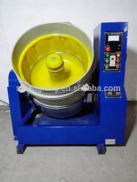 Centrifugal disc polishing machine for metal parts
