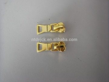 Garment golden metal zipper slider with puller