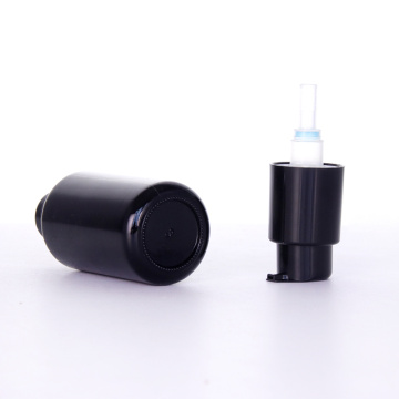 Schwarze Glaslotionflasche mit glänzender Pumpe