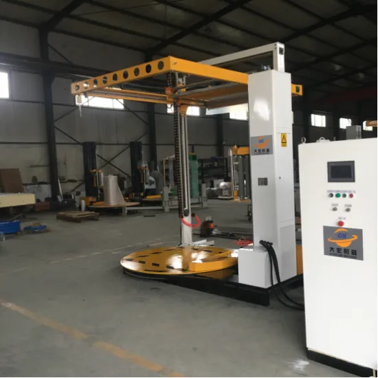 Pallet wrapping machine with top sheet cover