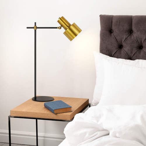 Lampe dorée et noire en laiton réglable pour le chevet