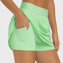 Faldas de tenis de golf femenina con pantalones cortos de bolsillos
