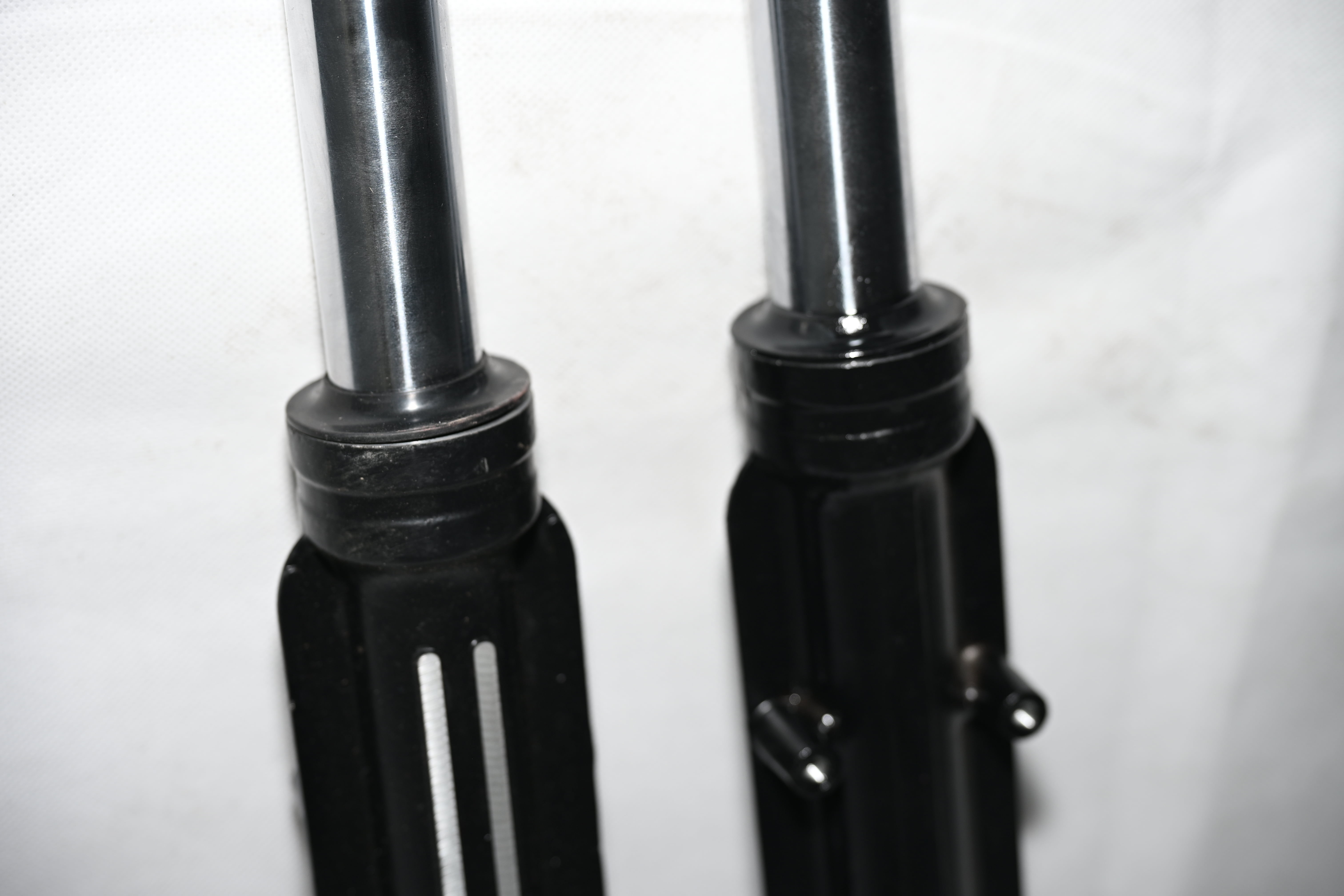Close-up of Ming Diamond three-wheeler shock absorber showing metal construction