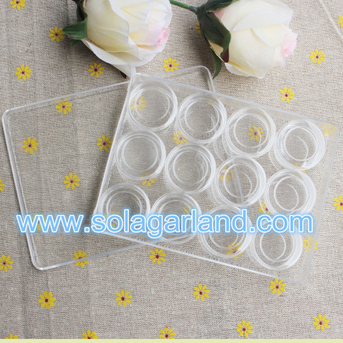 Caja de almacenamiento de joyería de plástico transparente con 12 pequeños envases cilíndricos redondos