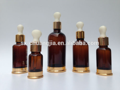 cosmetic packaging 30ml amber glass essential oil bottle with gold base gold dropper for serum