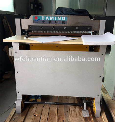 DM-610 Semi-automatic Paper Hole Punching Machine it machinates to make notebooks