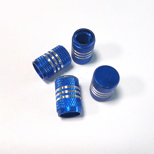 Tire valve stem caps with chrome stripes