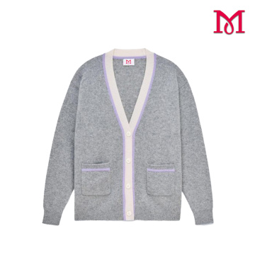 Top elegante de mujer de manga larga de punto gris